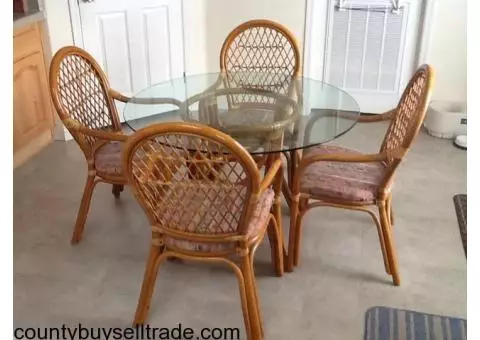 Glass top table and four chairs