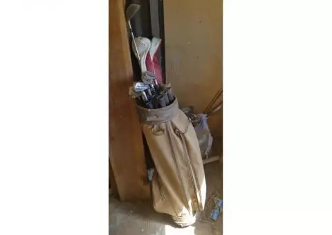 2 sets of golf clubs in bags, vintage