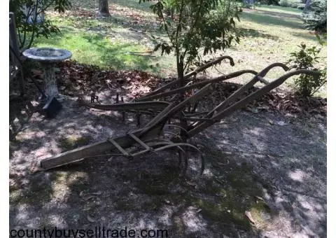 Old farm plows and various other equipment