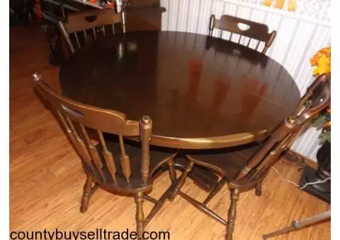 All wood table and chairs with extensions