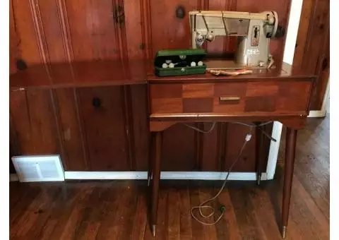 Singer sewing machine in cabinet