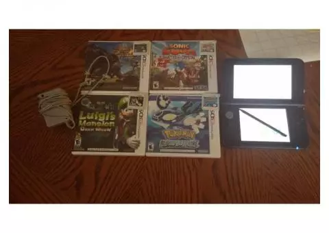 Black 3ds with 4 games (willing to haggle) charger included