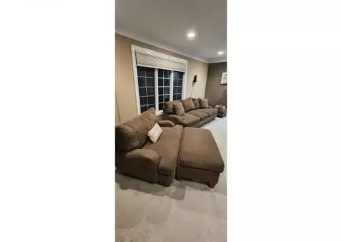 Large, plush sofa plus chair and a 1/2 with ottoman living room set