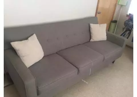 Lightly used couch, sleek and modern style. Medium/ light grey in color.