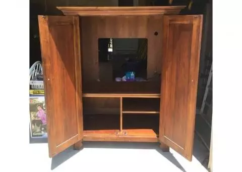 slightly used Cherry Wood entertainment center for $175