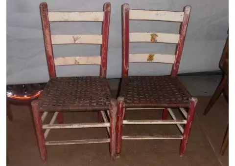 Pair of leather strapped chairs