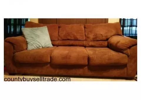 Chocolate brown sofa and loveseat