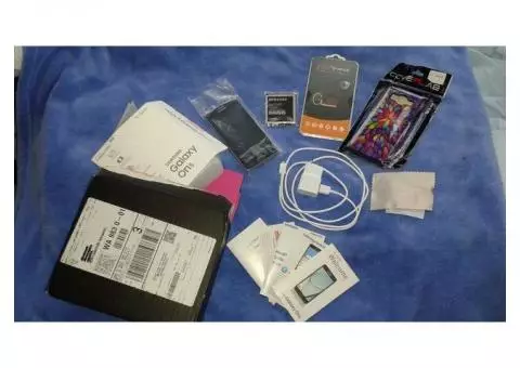 BRAND NEW (all still in original packaging) Samsung Galaxy On5 cell phone & accompanying wall ch