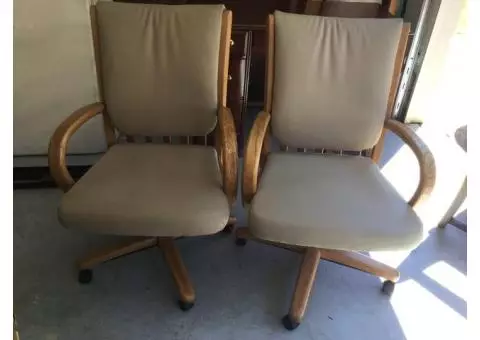 2 Leather swivel rocker roller arm chairs