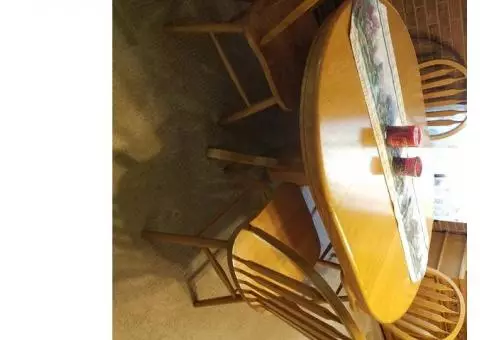 Dining room table, chairs, and matching hutch.