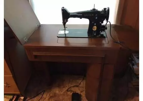 Antique Singer sewing machine with cabinet